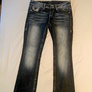 Vigoss “The Chelsea Slim Boot” low-rise dark-wash jean with faux diamond detail